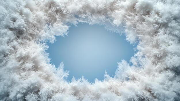 A circular frame made of snow and clouds photo