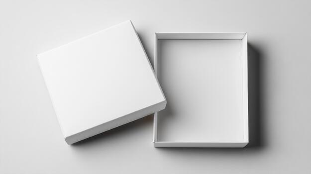 White box with open lid on a white surface photo