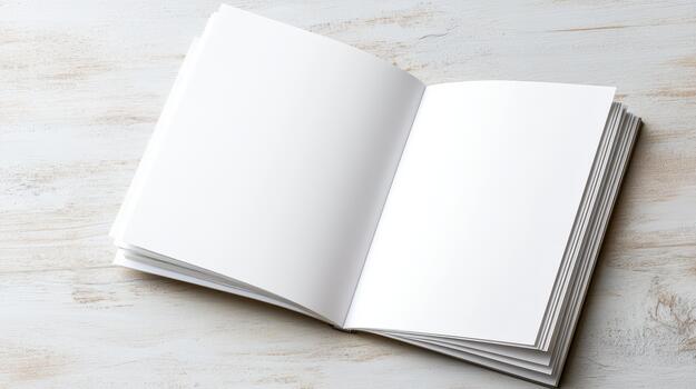 An open white book on a wooden table photo