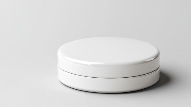 A white container with two lids on a plain surface photo