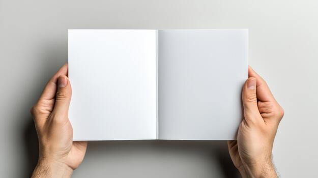 Hands holding open blank book on white background photo