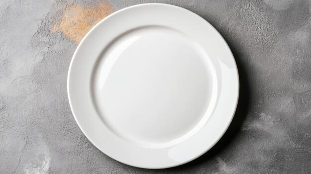 An empty white plate on a table photo