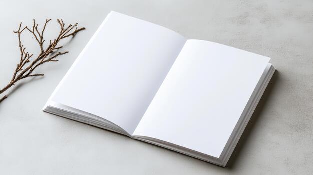 Blank white notebook with branch on white background photo