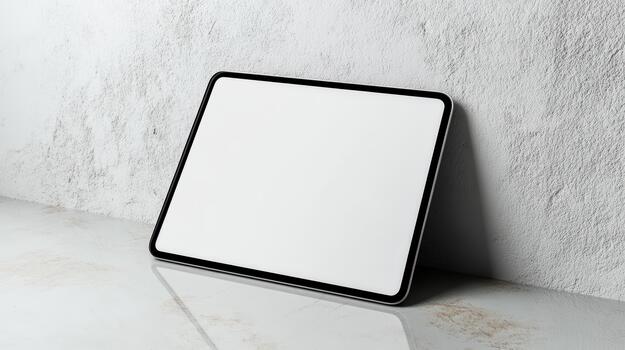 A white square frame sitting on a table photo