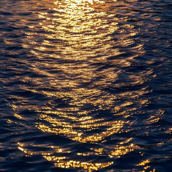 Golden Reflections on Water Captivating Ocean Surface with Light Dancing across Waves and Creating Abstract Patterns of Bright Sunlight Serene and Tranquil Scene photo