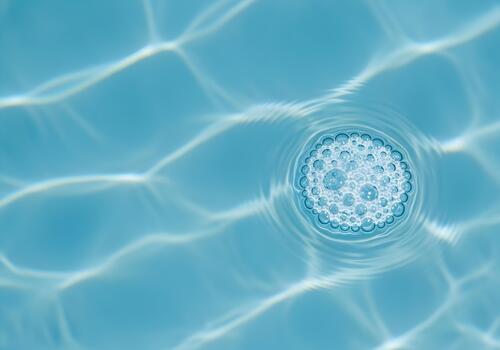 Sparkling Blue Water with Abstract Light Reflections and a Cluster of Bubbles Creating a Refreshing and Calming Underwater Scene Perfect for Relaxation and Summer Vacation Vibes photo