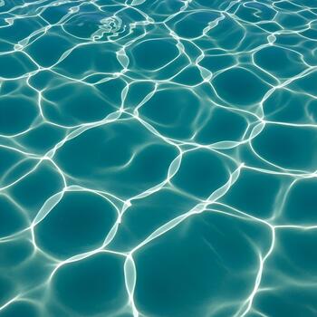 Turquoise Ocean Water Sparkling with Sunlight Reflection Creating Abstract Patterns Beautiful Calming and Serene Underwater View Perfect for Summer Travel and Relaxation Concepts photo