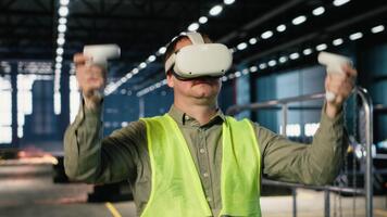 Employee uses VR headset to test 3D simulation concepts for heavy machinery in safety uniform, managing modern operation in factory facility. Professional workflow in warehouse. Camera B. video
