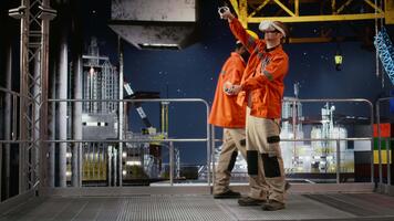 Offshore expert in VR headset simulating extraction and maintenance tasks, using futuristic technology to improve safety, efficiency and performance in the oil and gas industry. Camera A. video