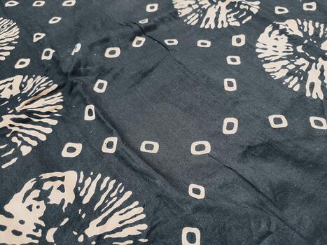 Pekalongan batik pattern, background, texture with black base color and round motif photo
