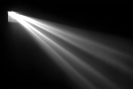 Light beams shining through a dark space photo
