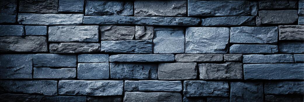 Dark stone wall with varied textures and shapes photo