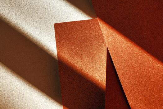 Warm tones and shadows dance on textured paper photo
