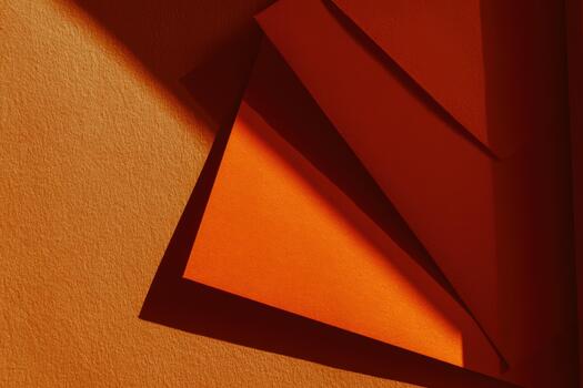 Colorful orange paper layers with shadows on surface photo