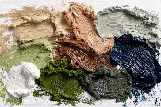 Artistic palette with colorful paint mixtures on canvas photo