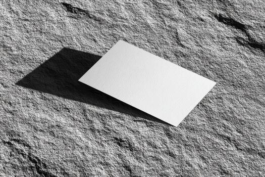 Simple business card on textured stone surface photo