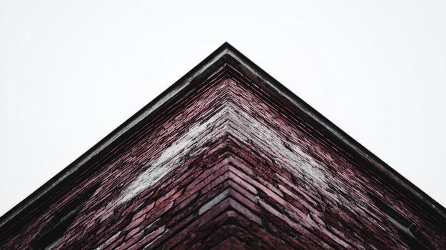 View of the brick wall from below at an urban building photo