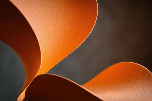 Curved orange shapes create modern art in a soft light photo
