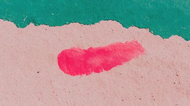 Colorful paint stroke on textured surface in bright tones photo