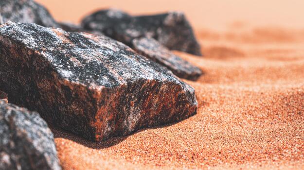 Rocks resting on warm sandy surface at desert location photo