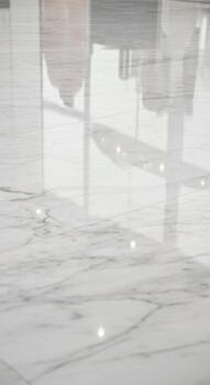 Abstract close up of a bright textured surface with subtle light reflections and geometric patterns creating a modern aesthetic photo