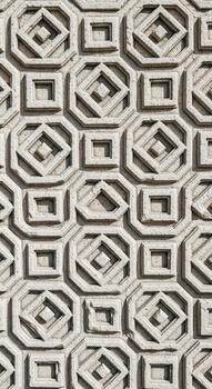 Intricate geometric pattern of interlocking octagons and squares in light beige textured surface photo