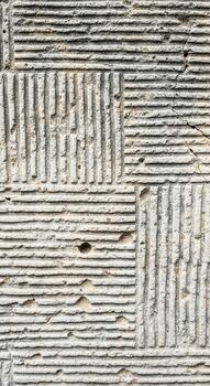 Abstract textured background with a repeating pattern of horizontal and vertical grooved lines creating a unique visual effect photo