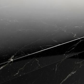 Abstract black and white marble texture with subtle linear light reflection creating a dramatic and elegant surface photo