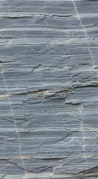 Close up abstract view of layered gray paper or cardboard with subtle horizontal lines and texture photo