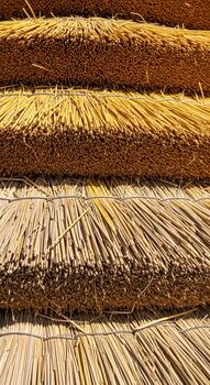 Close up view of layered dried straw or reeds creating a textured natural background pattern photo