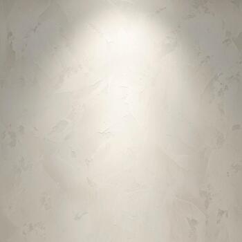 Soft spotlight illuminating a textured neutral background with subtle gradients and a faintly visible pattern photo