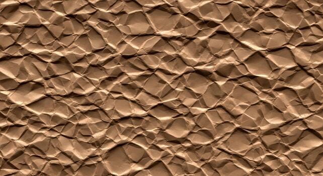Close up view of a textured brown surface with a repeating pattern of irregular raised and shadowed geometric shapes creating a tactile visual effect photo