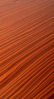 Abstract ripples of warm orange and red hues create a textured surface with repeating parallel lines photo