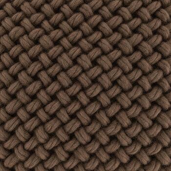 Close up view of a woven brown fabric texture with a detailed diagonal pattern and visible threads photo