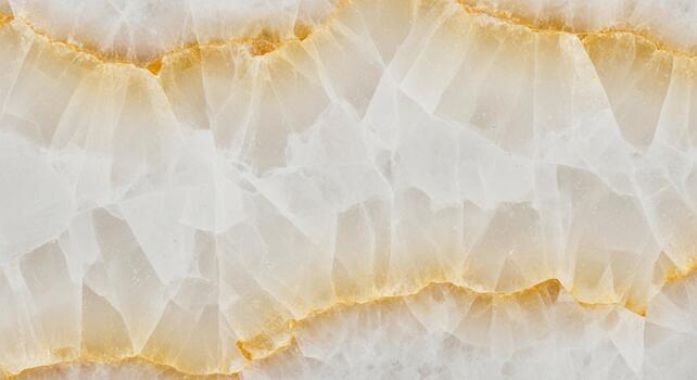 Abstract close up of translucent white and golden yellow marble texture with soft flowing patterns photo