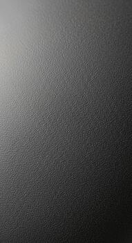 Subtle textured gradient background with a soft light effect in shades of gray and black photo