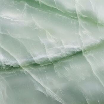 Abstract swirling patterns of light green and white create a soft ethereal and organic texture resembling natural stone or flowing silk photo