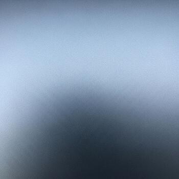 Abstract gradient of cool blue and grey tones creating a serene and calming atmospheric background for design photo