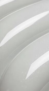 Abstract diagonal stripes of light gray and white create a subtle textured background pattern photo