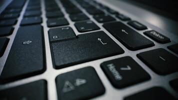 Macro closeup of pressing the enter key on a laptop keyboard, showing tactile action and modern computer interface video