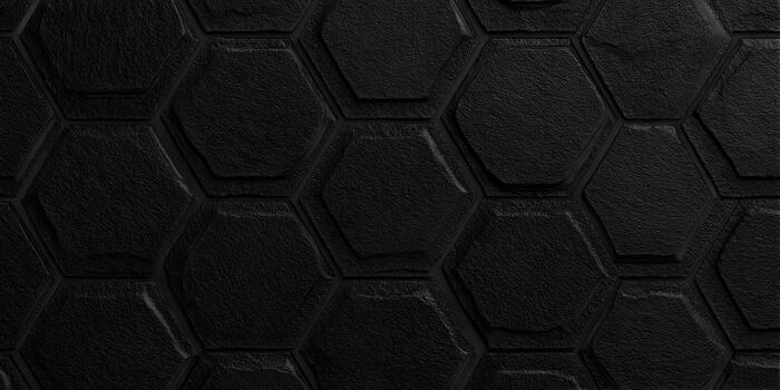 A seamless dark textured hexagonal pattern forms an abstract background photo