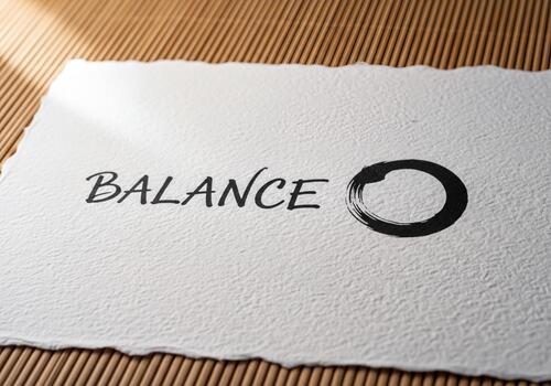 Minimalist Zen Balance with Hand-Drawn Enso Symbol and Script Text on Textured Paper photo