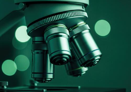 Detailed view of a scientific microscope objective lenses and turret photo