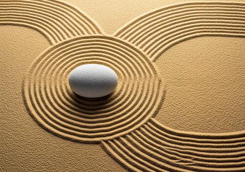 Zen Garden Stone in Raked Sand with Circular and Wavy Patterns for Harmony and Meditation photo