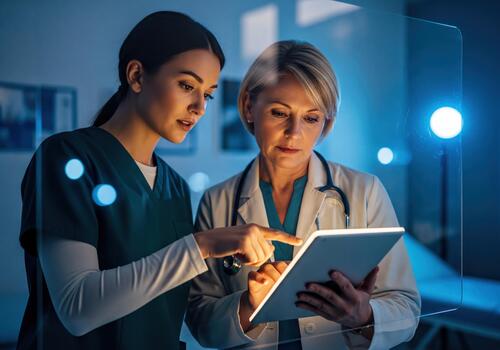 Healthcare Professionals Collaborating with Tablet Technology in Modern Clinical Setting photo