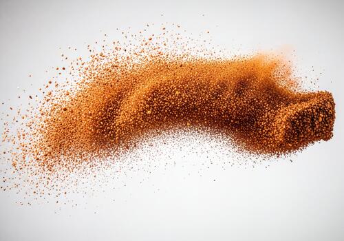 Dynamic Orange Powder Explosion with Flying Particles on Clean White Background photo