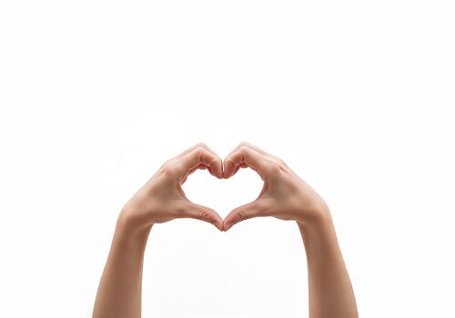 Hands forming heart shape gesture expressing love and care photo