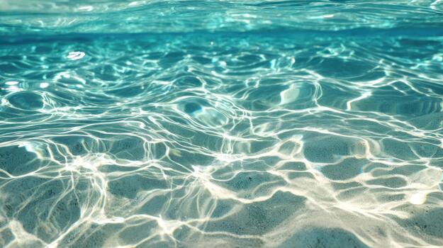 Clear turquoise water surface with sunlight reflections abstract background photo