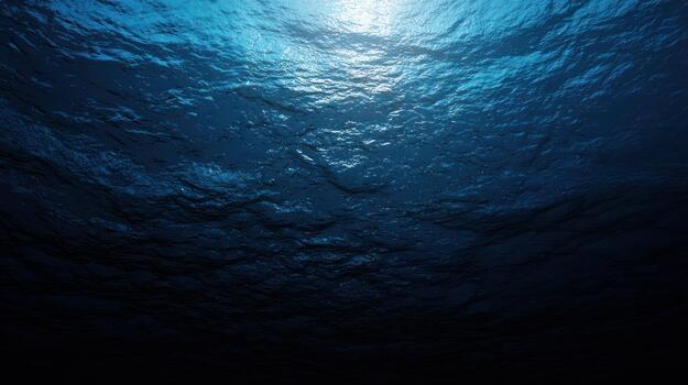 Underwater scene rippled surface and sunlight deep blue ocean background photo