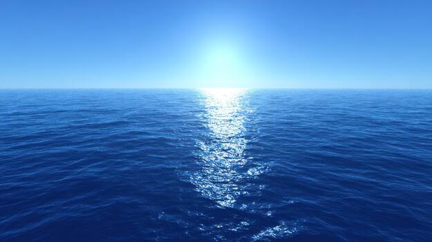 Ocean surface under bright sunlight with horizon line and copy space photo